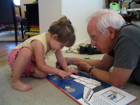 Schmidt showing his granddaughter Maya the space shovel.