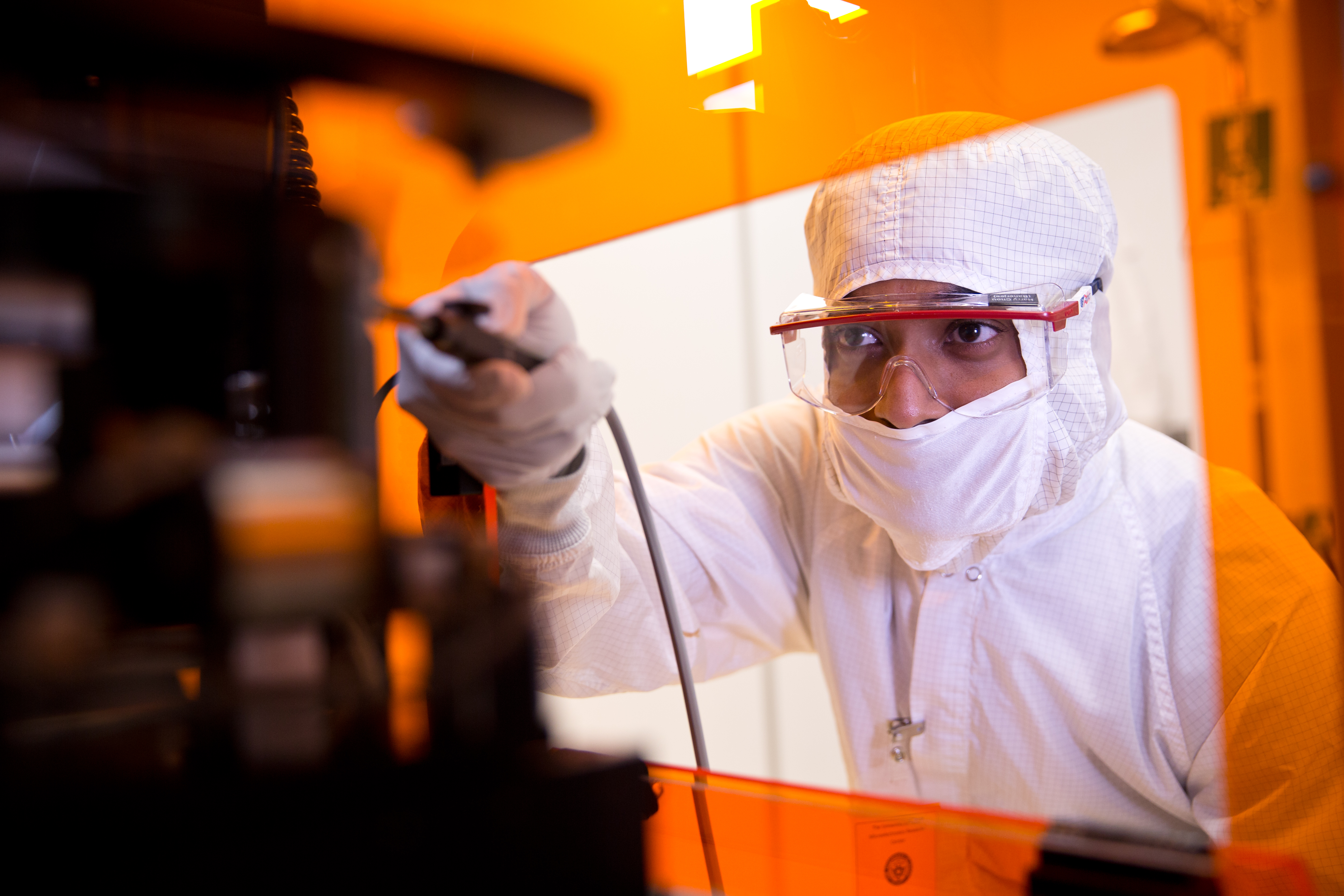 Student in lab working on equipment