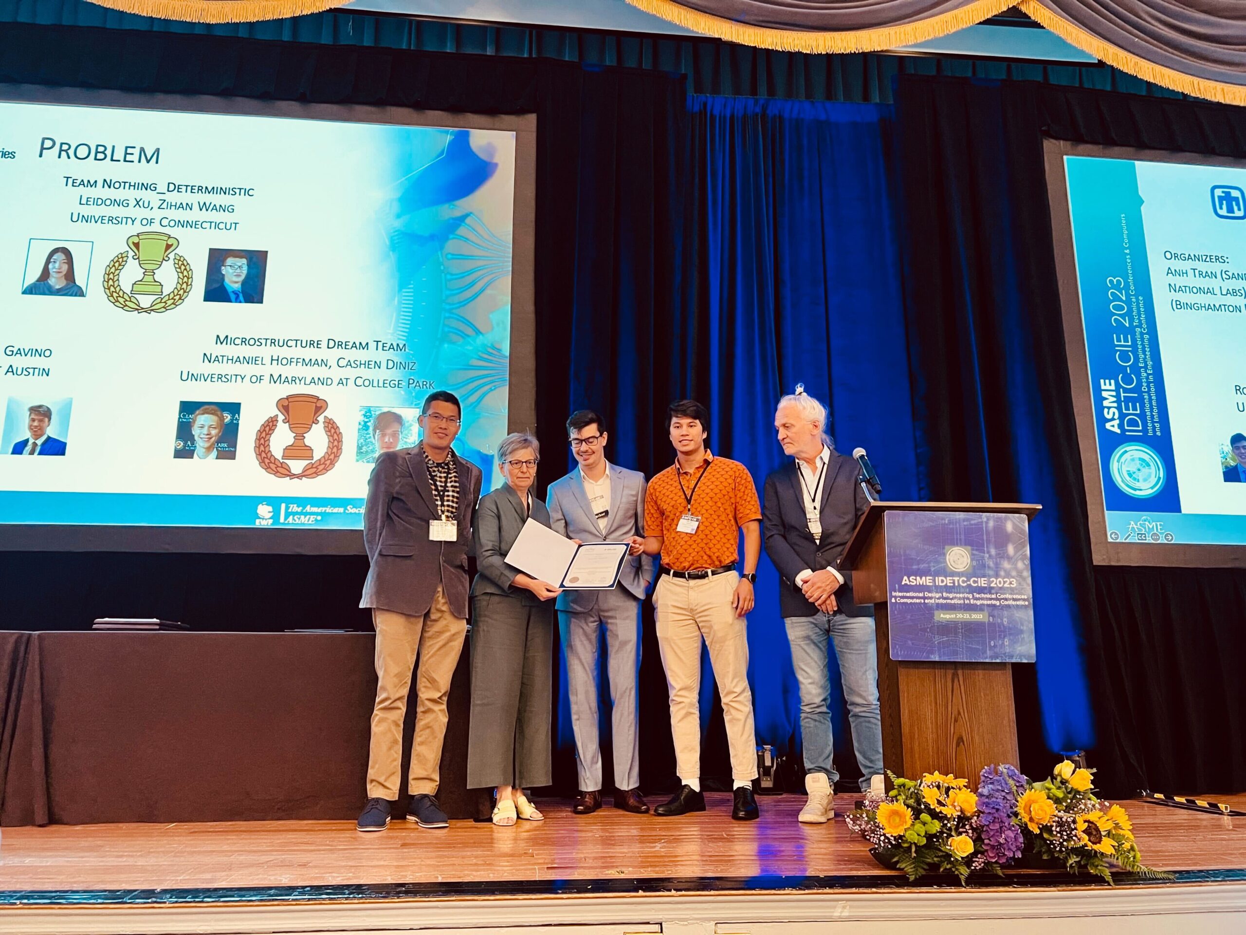 Ronnie Stone and Phillip Gavino receive award on stage