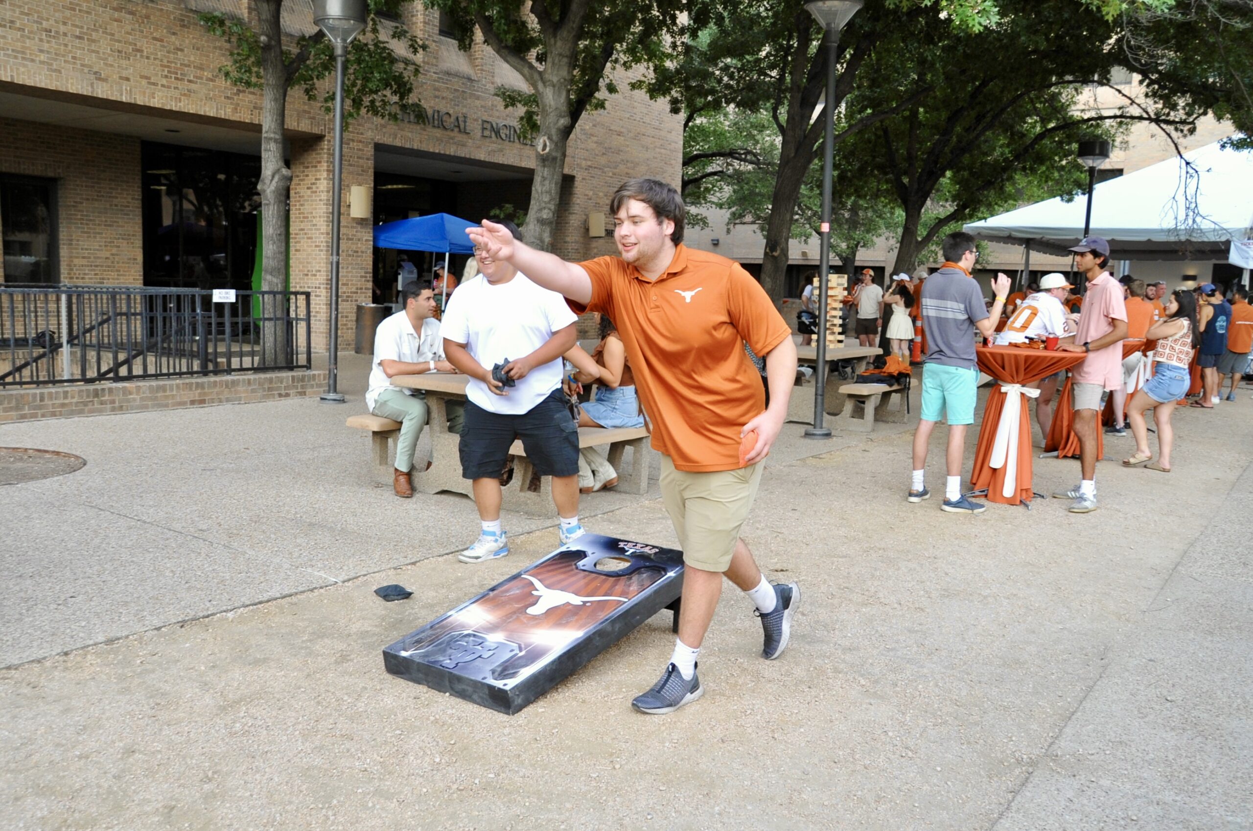 students playing cornhole