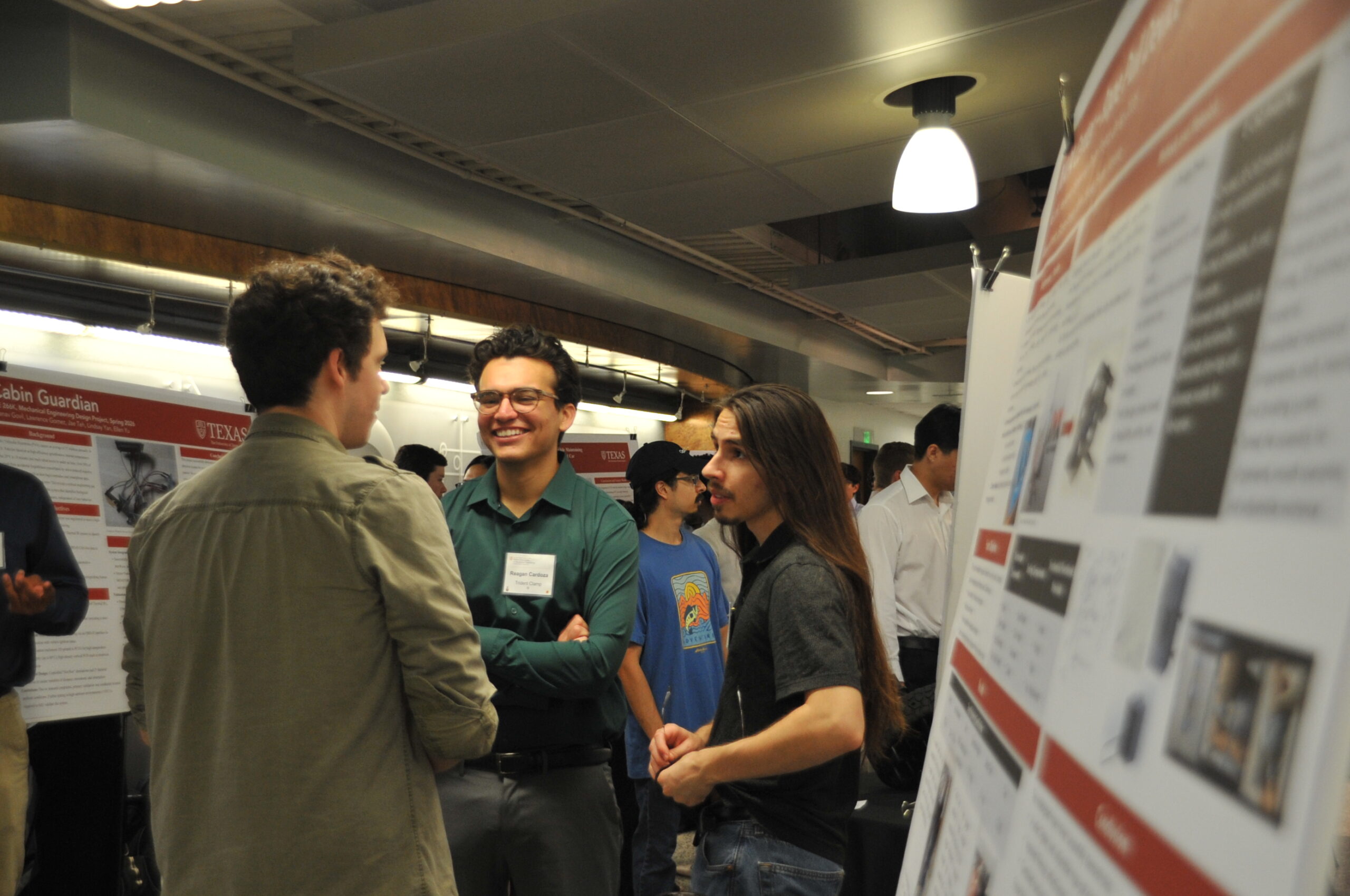 students talking in front of poster