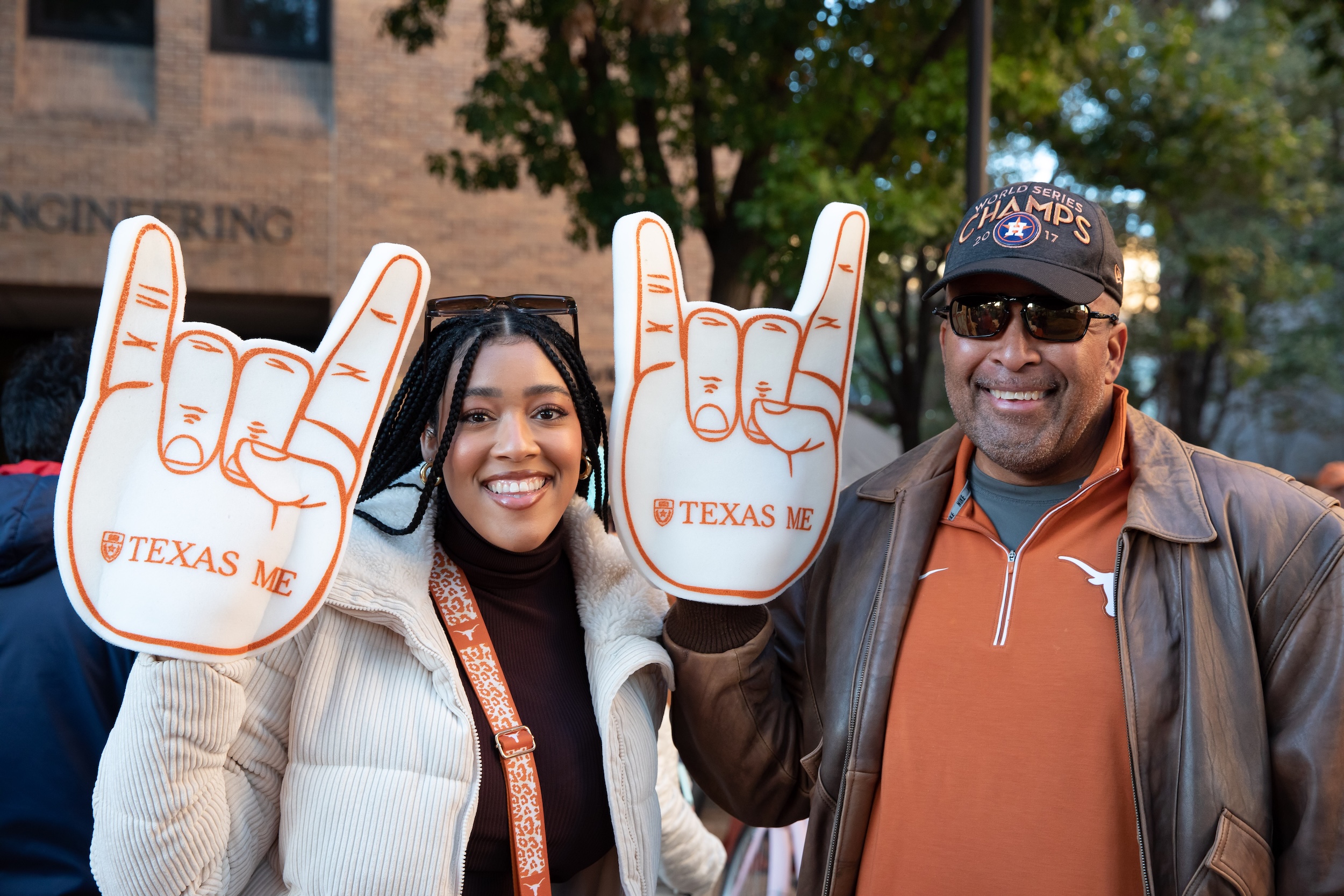 Mechanical engineering alumni with foam fingers at UT Austin