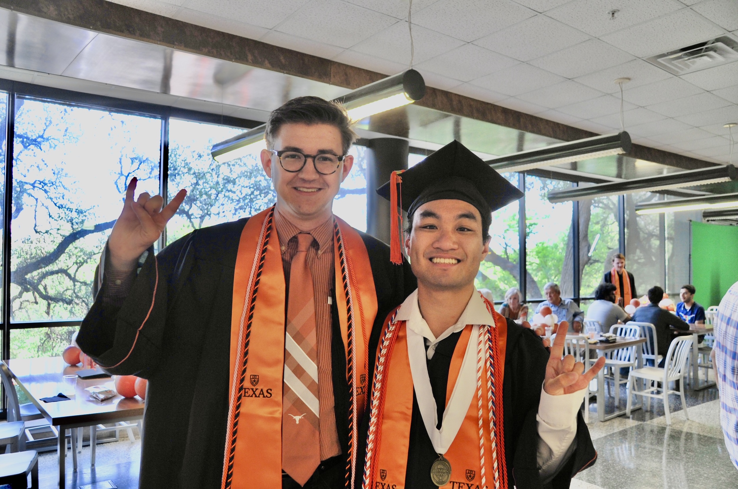 two UT Austin Mechanical engineers at a graduate reception
